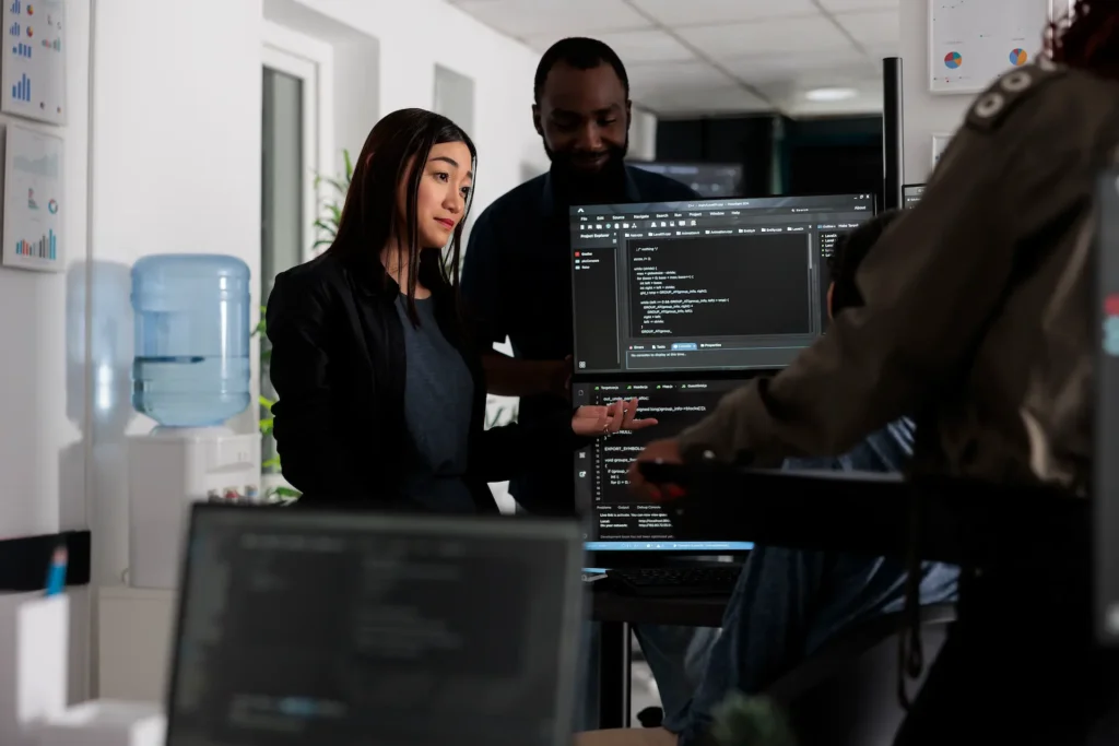 multi ethnic programmers checking source code and 2025 02 18 23 03 17 utc